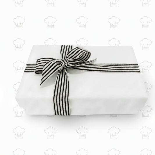 White gift box with black ribbon and chef's hats on pure white background
