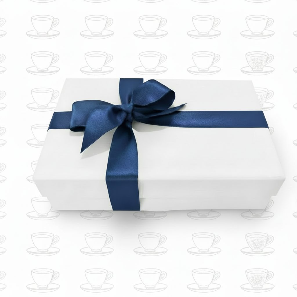 White gift box with navy ribbon on pure white teacup background